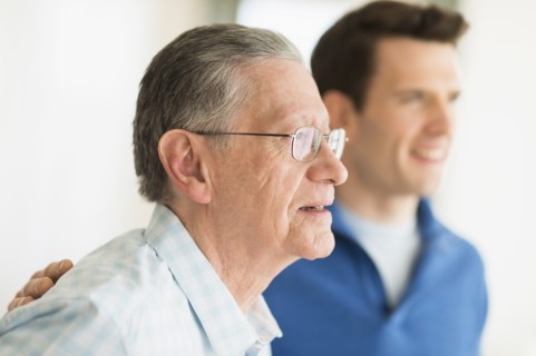 Caucasian father and son smiling