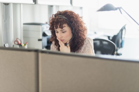 Hispanic businesswoman working in office