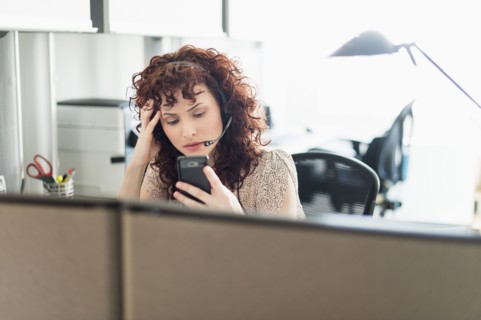 Hispanic businesswoman working in office