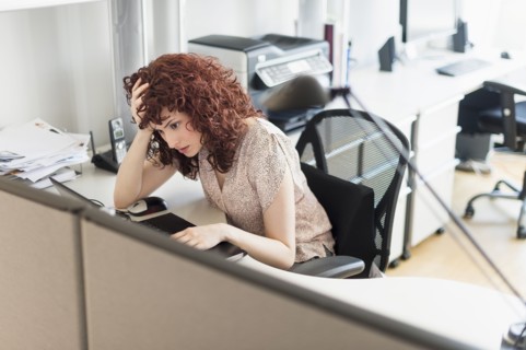 Hispanic businesswoman working in office