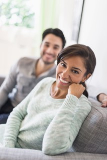Couple relaxing together on sofa