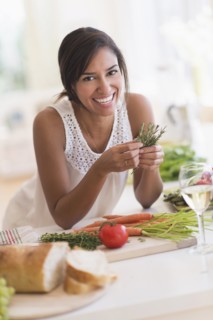 Hispanic woman cooking in kitchen