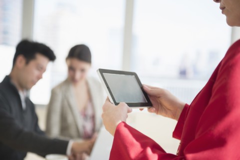 Businesswoman using digital tablet in office