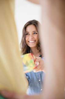 Woman giving boyfriend gift