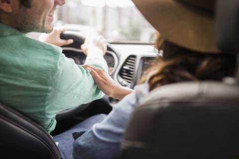 Couple driving together in car