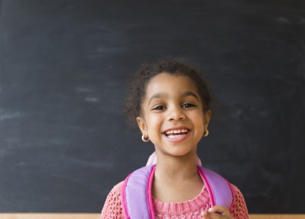 African American girl smiling in classroom