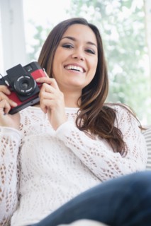 Woman taking pictures with camera