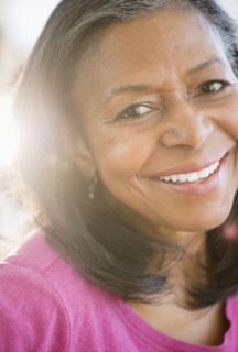Close up of mixed race woman smiling
