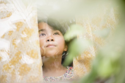 Filipino girl looking out window