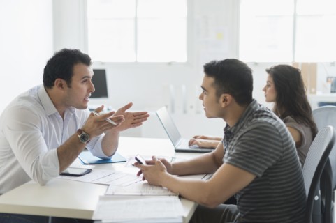 Hispanic business people working together in office