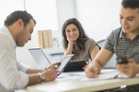 Hispanic business people working in office