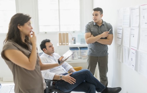 Hispanic business people working together in office