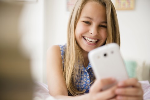 Caucasian girl using cell phone