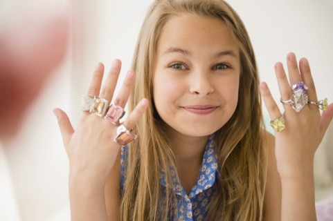 Caucasian girl wearing costume rings
