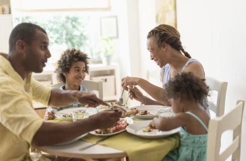 Family eating together at dining room table