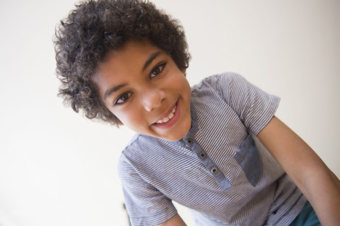 Mixed race boy smiling