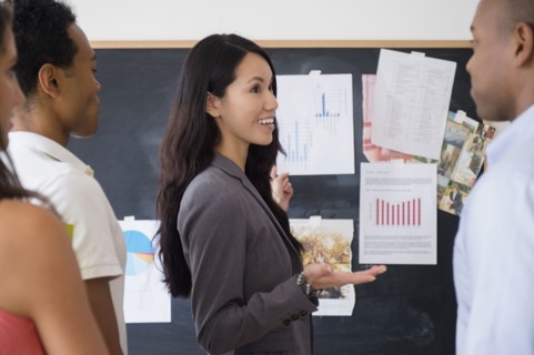 Business people examining presentation in meeting