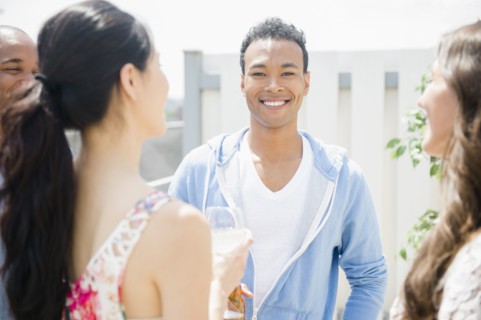 Friends talking at party