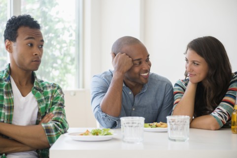 Man surprised at friends flirting