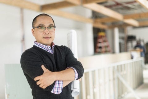 Korean businessman standing with arms crossed