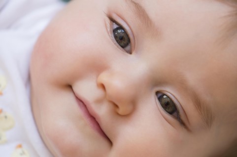 Close up of smiling mixed race baby