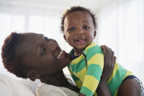 Black mother holding baby boy