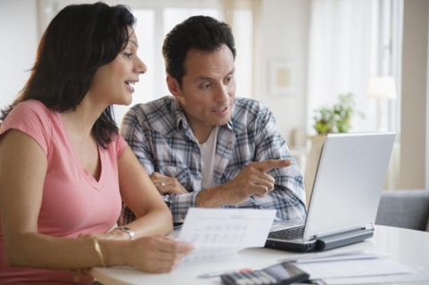 Couple paying bills online
