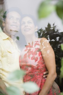 Couple hugging and looking out window