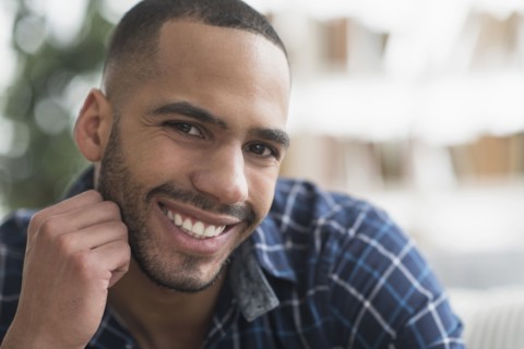 Close up of Hispanic man smiling