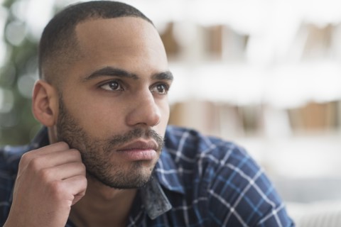 Close up of face of serious Hispanic man