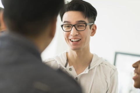 Smiling friends talking