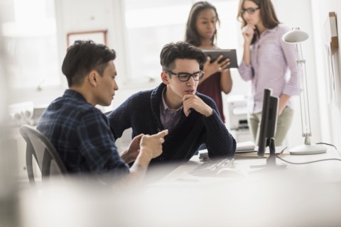 Businessmen working together in office