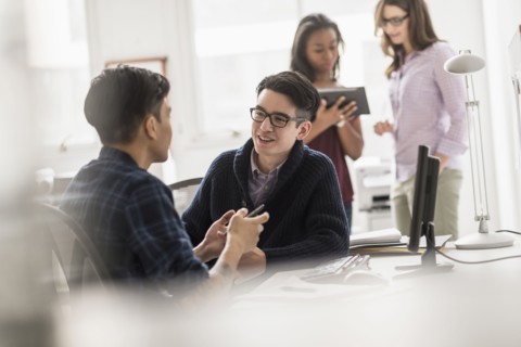 Businessmen working together in office