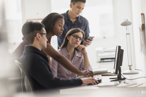 Business people working together at computer