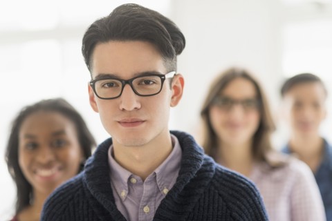 Close up of smiling businessman in office