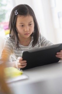 Chinese student using digital tablet