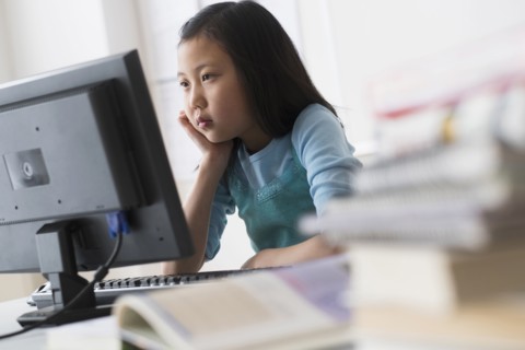 Chinese student using desktop computer