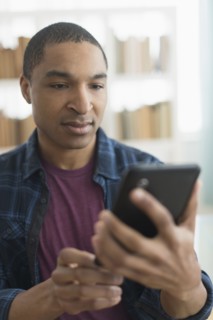 Black man using digital tablet
