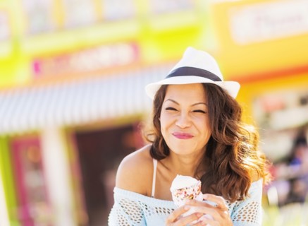 Chinese woman eating ice cream cone