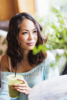 Close up of Chinese woman drinking smoothie