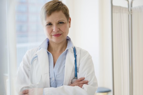 Caucasian doctor standing with arms crossed