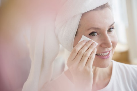 Caucasian woman wiping face