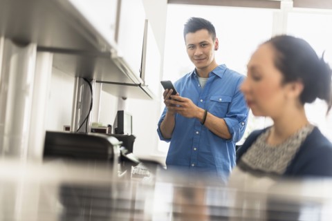Business people using technology in office