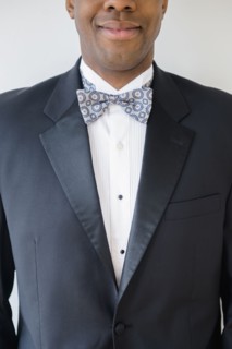 Close up of smiling groom wearing tuxedo
