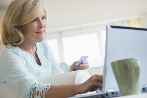 Caucasian woman shopping online with laptop
