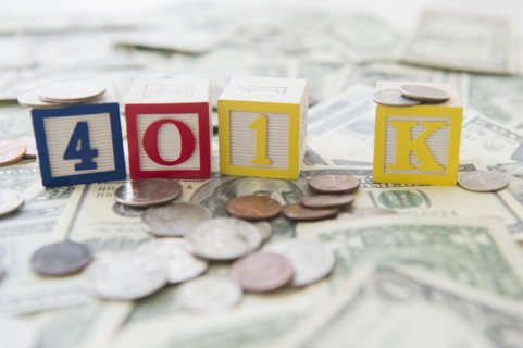 Close up of 401K toy blocks and money