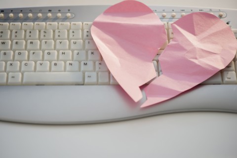 Close up of broken heart on computer keyboard