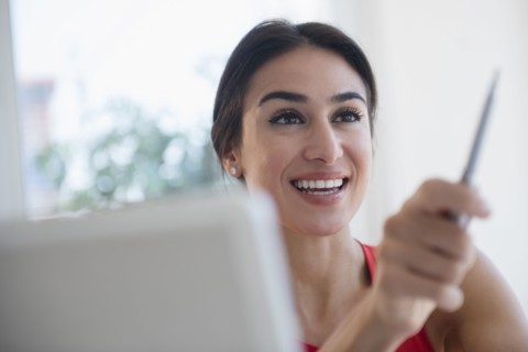 Businesswoman gesturing with pen