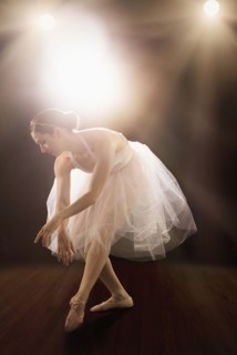 Hispanic ballet dancer performing on stage