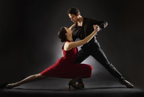 Hispanic salsa dancers performing